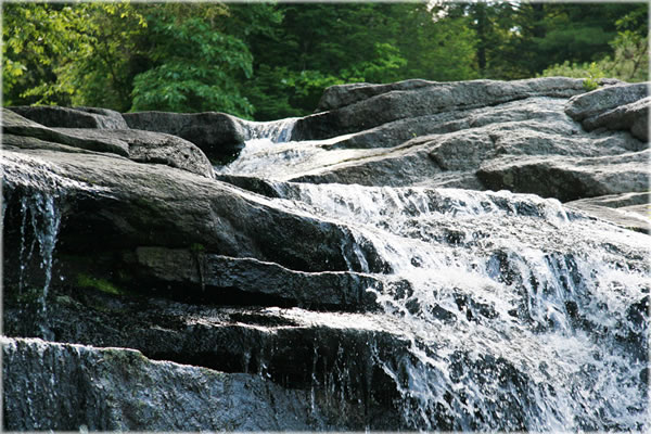 Waterfall along Coxing Creek in High Falls, near New Paltz, New York. Photo by Eric Francis.